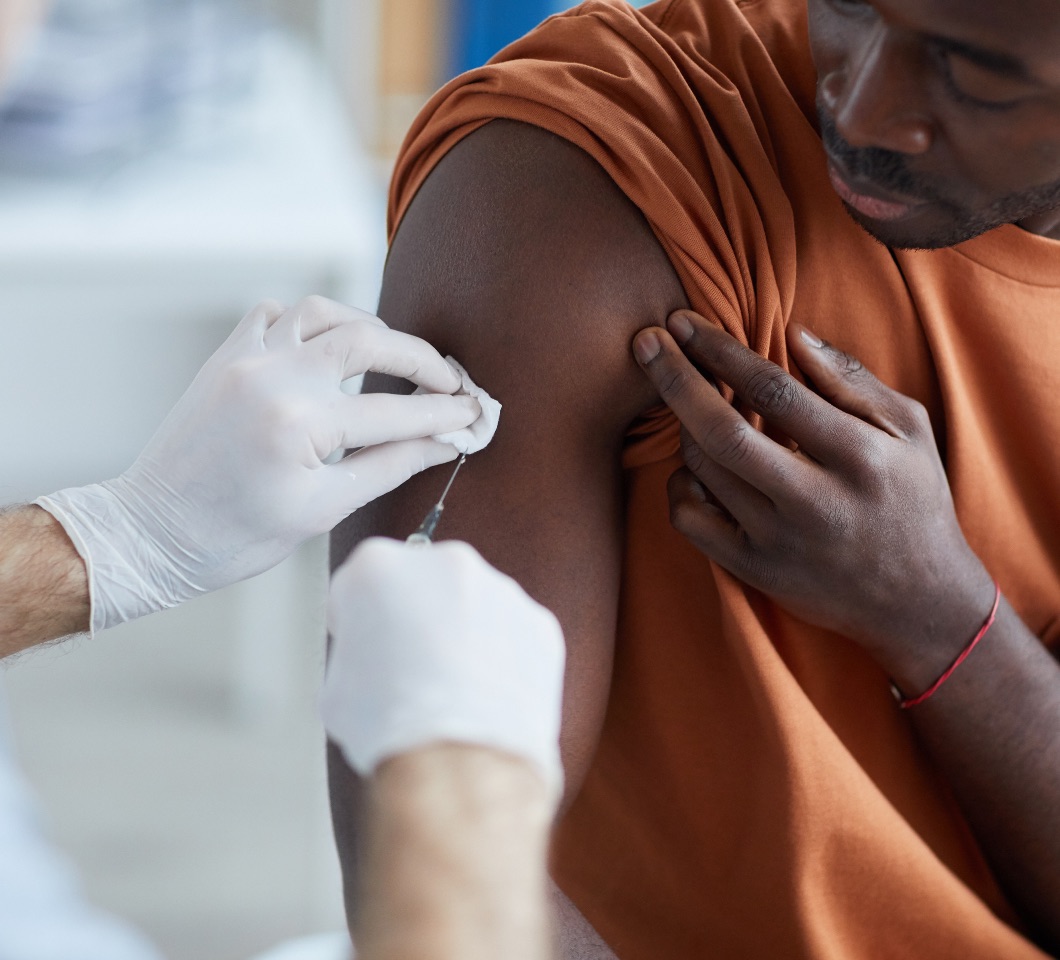 Photo of a man getting a covid vaccination