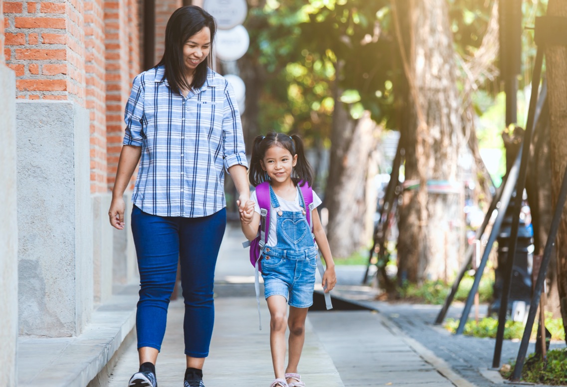 Parent walking child to school