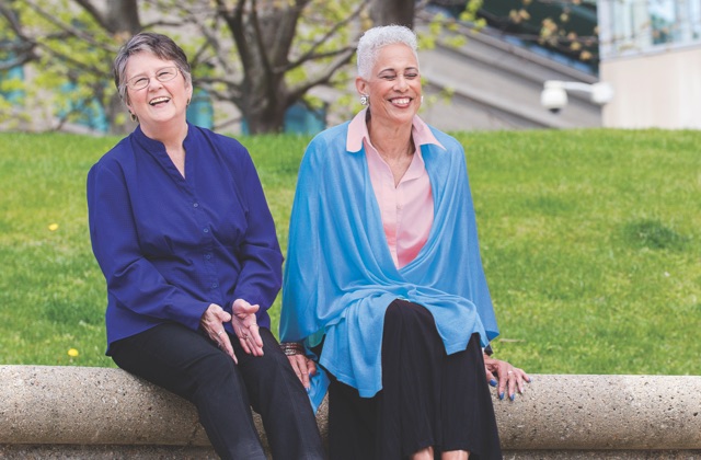 Women sitting together and smiling