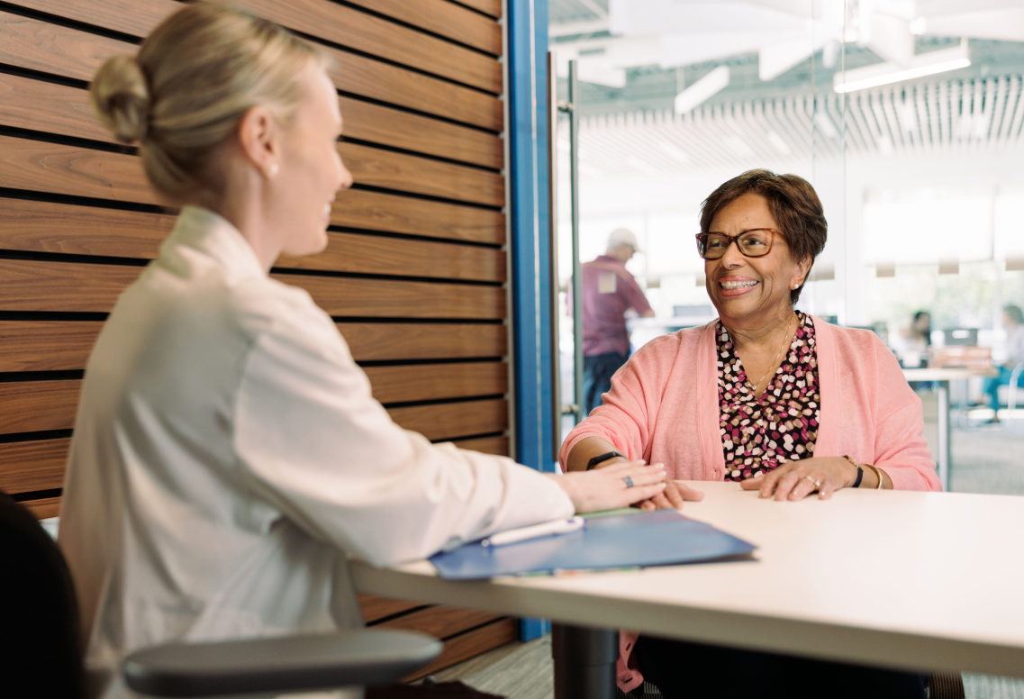 BCBSRI Care management associate speaking with a person