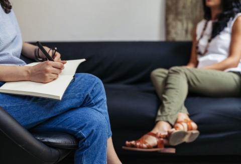 Patient talking with doctor on couch