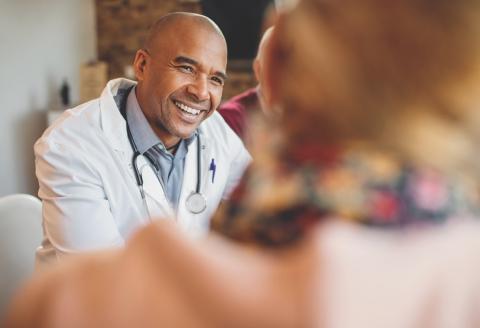 Doctor talking with patient