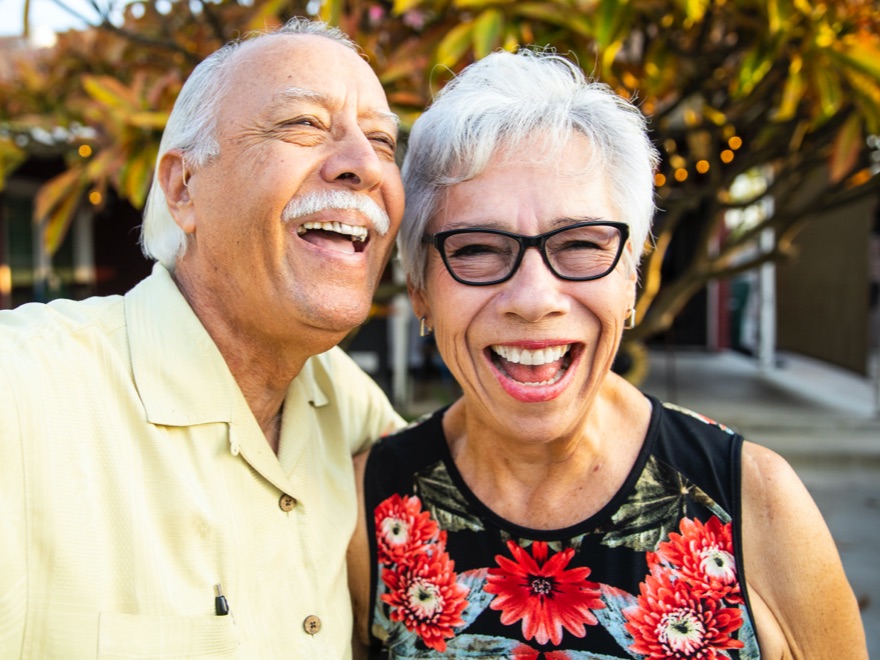 Happy couple looking at camera