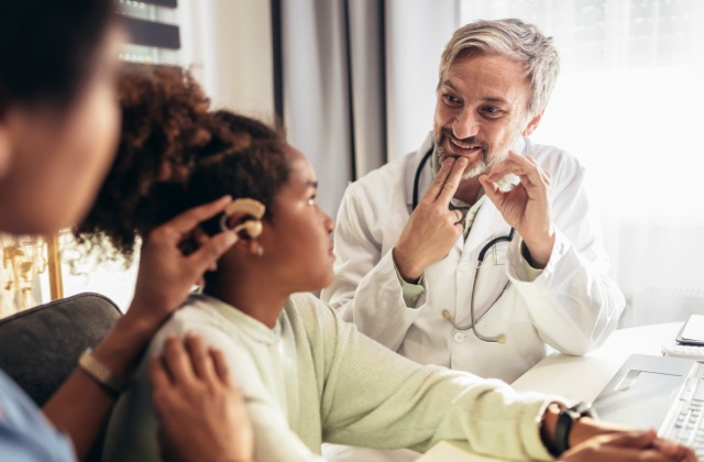 Photo of doctor with a deaf patient