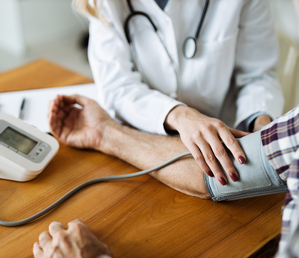 Photo of person taking their blood pressure