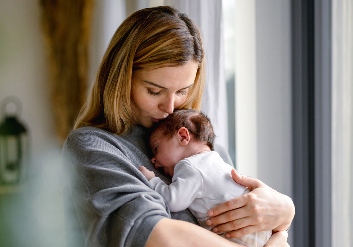 Photo of mother holding her newborn baby