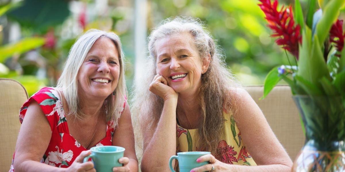 two women drinking coffee