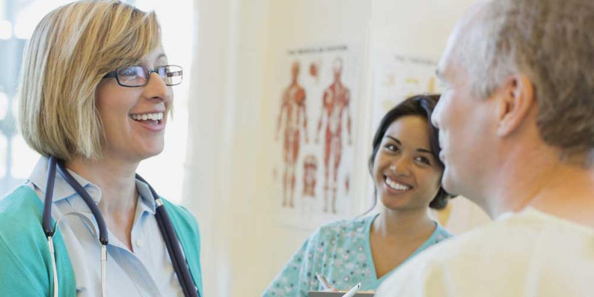 man speaking with doctor